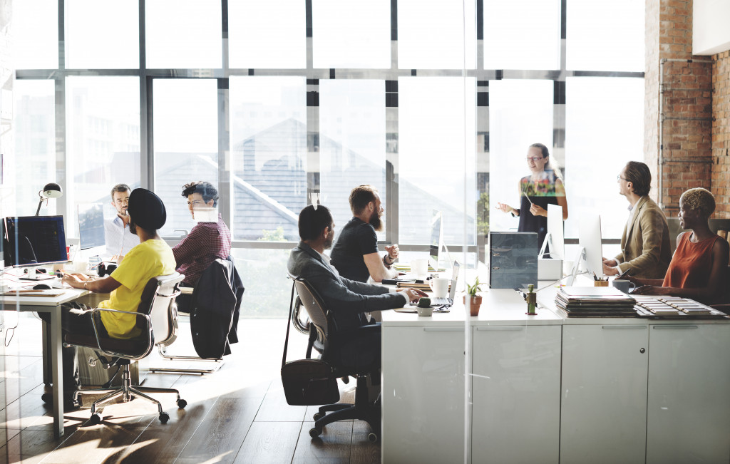 Employees from different backgrounds working in an office