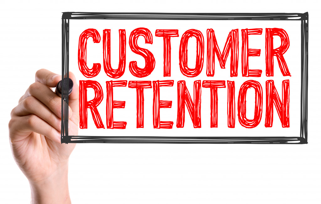 A sign stating CUSTOMER RETENTION