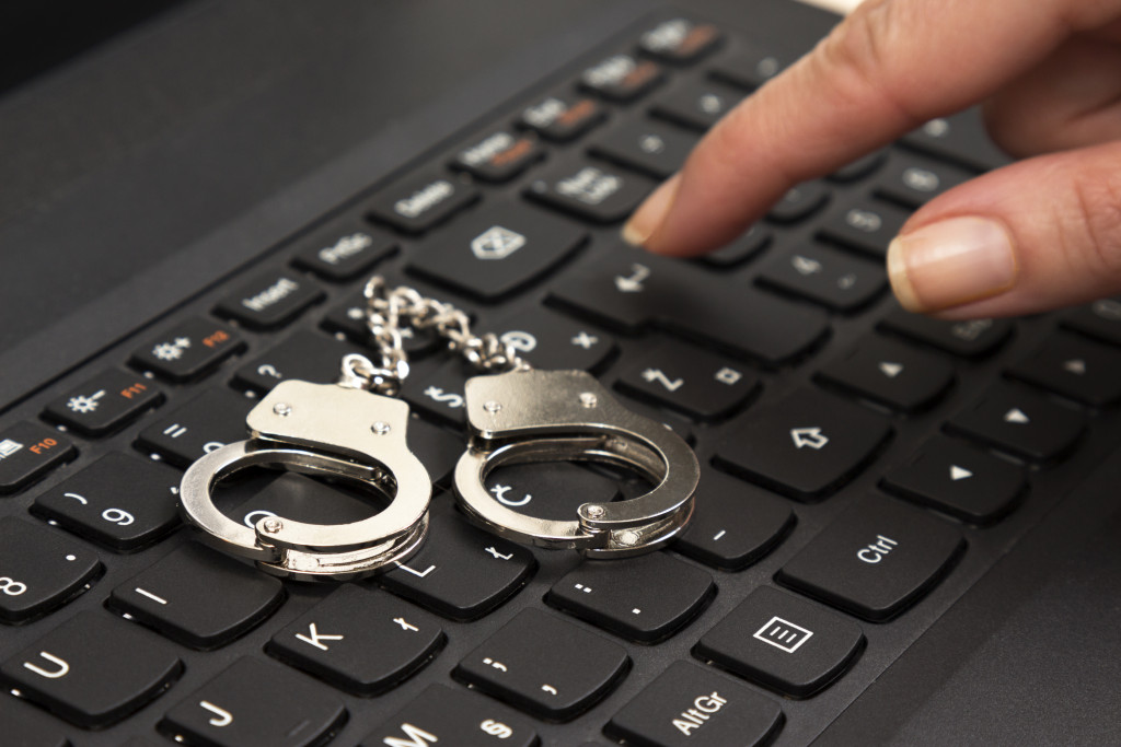 Mini handcuffs on a laptop keyboard